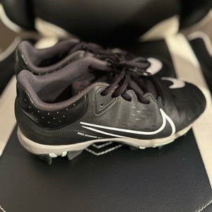 Black Nike softball rubber cleats
